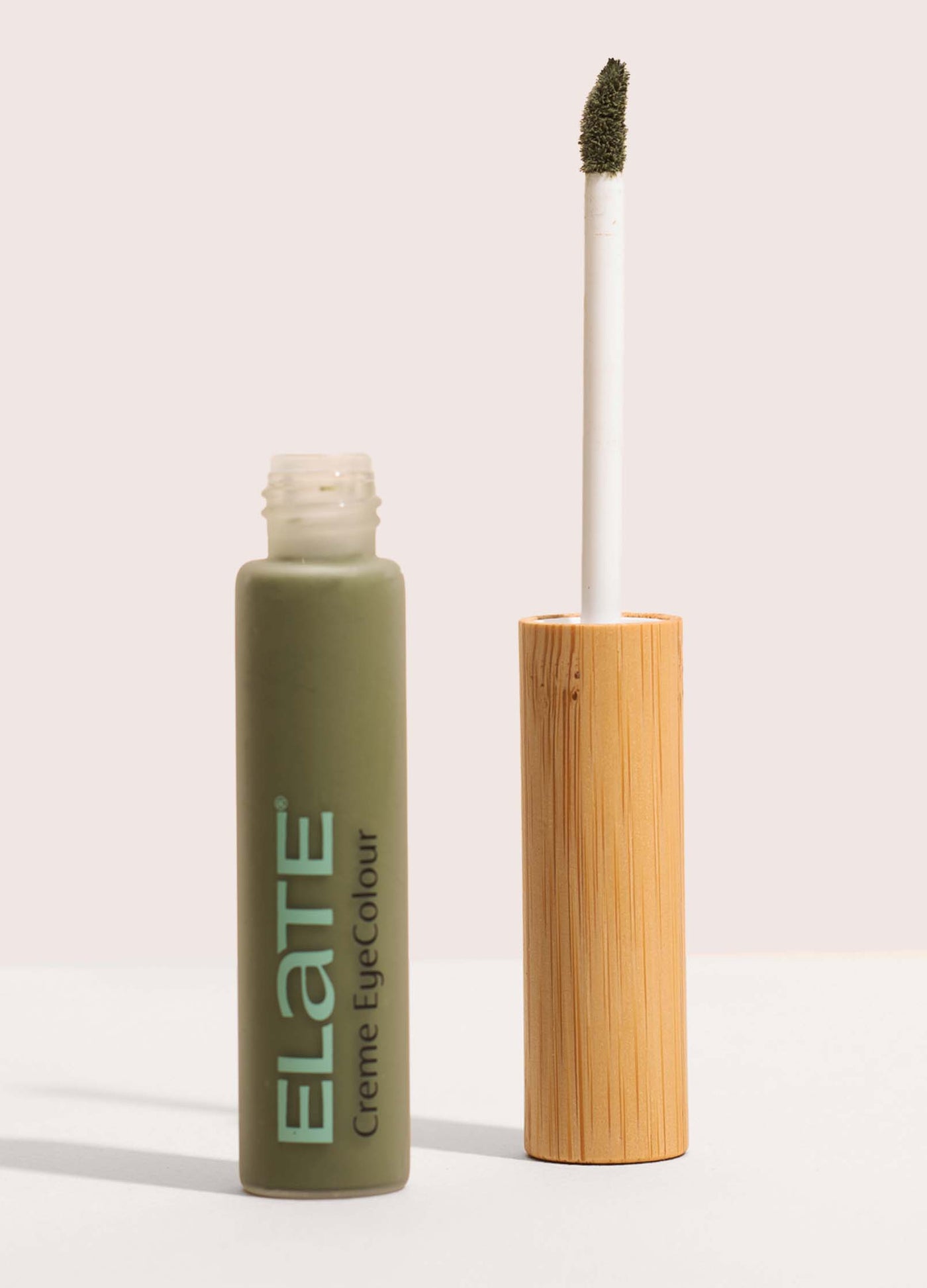 Elate Cosmetics Creme EyeColour open glass tube with bamboo applicator handle - curious